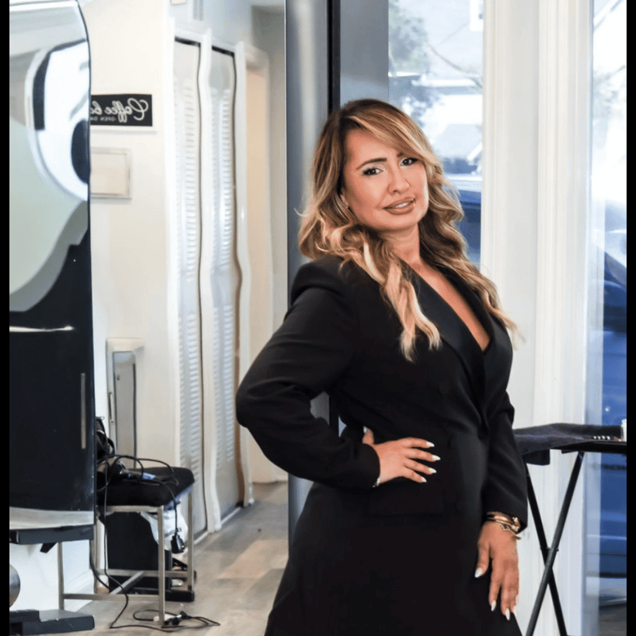 Portrait of ELLA CORRI, a professional stylist at Runway Salon & Beauty Bar, showcasing their expertise and style.