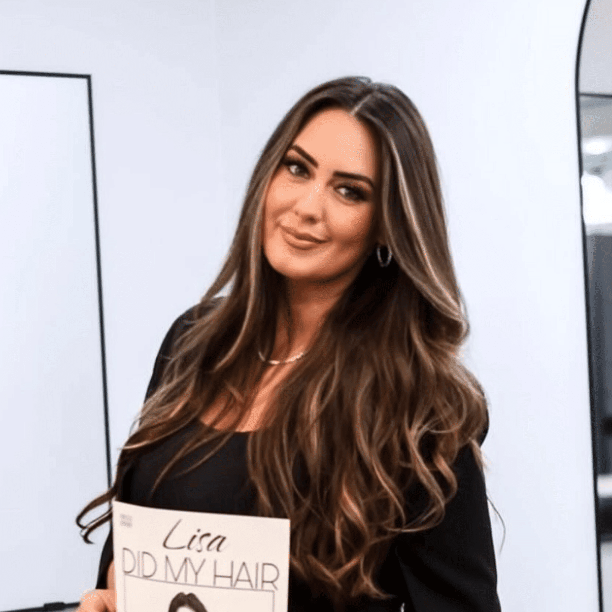 Portrait of LISA MALAJ, a professional stylist at Runway Salon & Beauty Bar, showcasing their expertise and style.