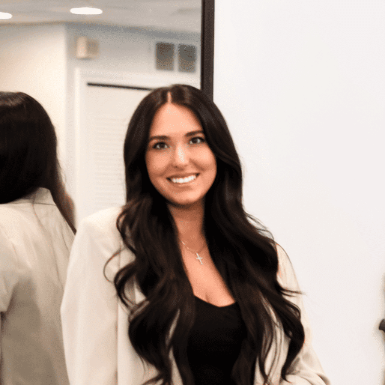 Portrait of LILY NIKOLLAJ, a professional stylist at Runway Salon & Beauty Bar, showcasing their expertise and style.