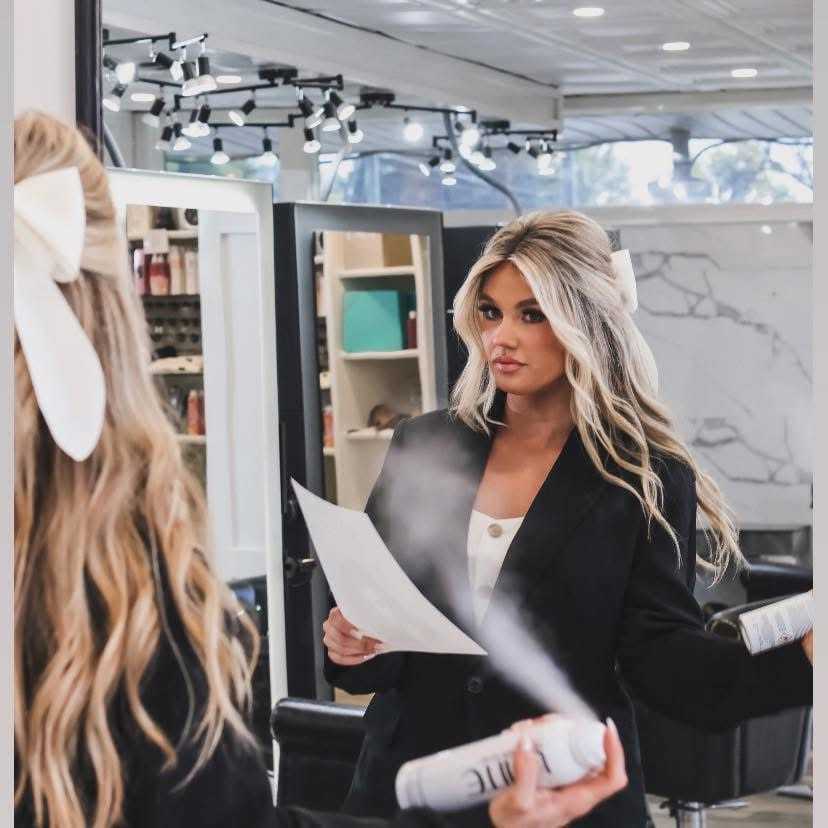 Portrait of ASHLEY HILLIS, a professional stylist at Runway Salon & Beauty Bar, showcasing their expertise and style.