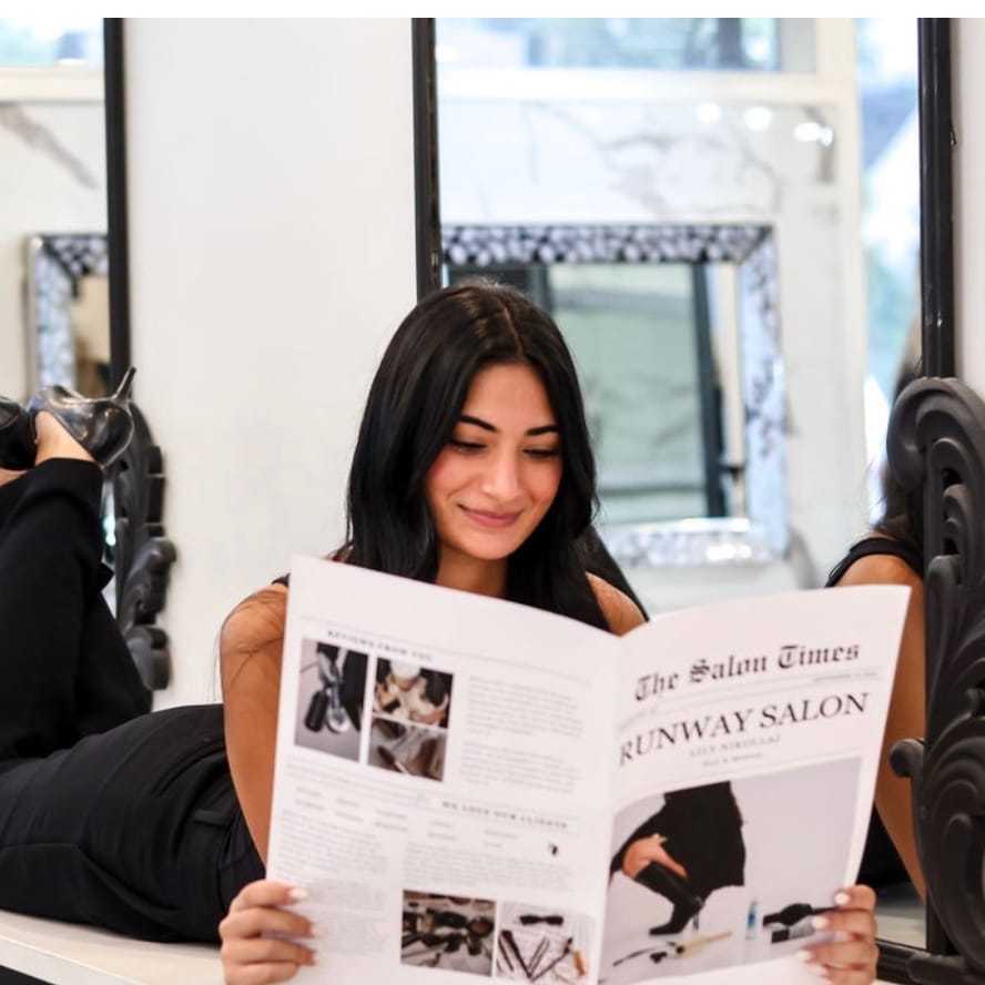 Portrait of ADRIANNA GARMO, a professional stylist at Runway Salon & Beauty Bar, showcasing their expertise and style.